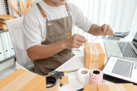 Ecommerce startup demonstrating modern online business model, combining packaging, logistics, and digital retail strategies to empower small business growth in global trade.の写真素材