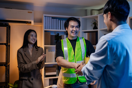 A diverse team of professionals shares ideas about architectural layouts and structural concepts, focusing on teamwork, creativity, and precision in modern engineering design discussions.の写真素材