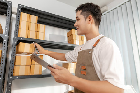 Entrepreneur in ecommerce startup preparing goods for online selling, reflecting small business...