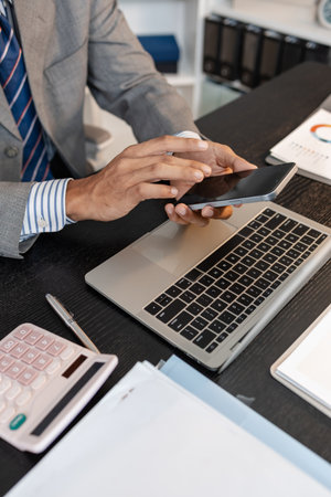 Businessman working at his desk in professional office environment, focusing on decision making,...