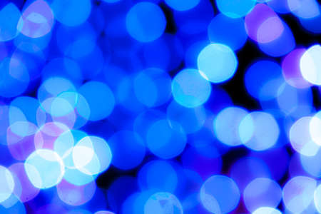 blue light bokeh and the dark blackgroundの写真素材