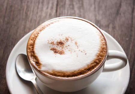 a cup of coffee on the wooden floor or tableの写真素材