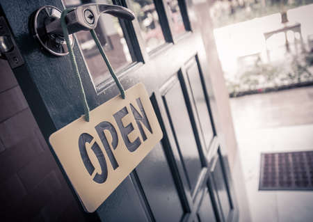 Vintage wooden door open sign and handleの写真素材
