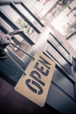 Vintage wooden door open sign and handleの写真素材
