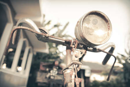 A rusty handlebar vintage bicycle and lightの写真素材