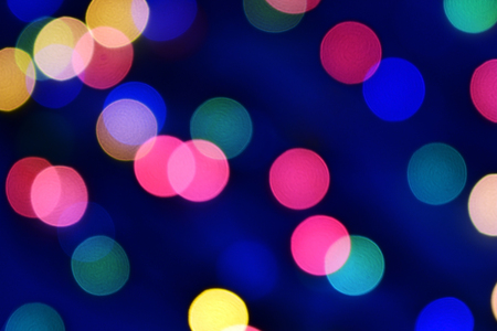 Blue christmas bokeh with light beautifully little lights. Blurred background. Place for your text, message or congratulations. Defocused abstract red background.の写真素材