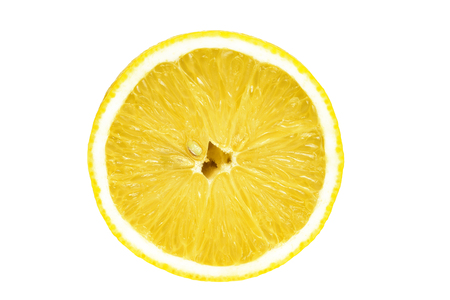 One sliced isolated lemon on a white background. Top view. Yellow color.の写真素材