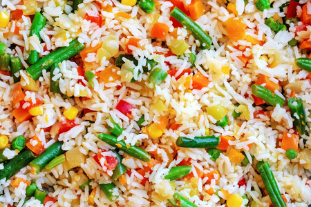 Texture of rice with vegetables close-up. You can place text or advertising on top.の写真素材