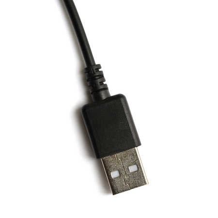 Black USB cable plug isolated on white background. Top view, macro. The reverse side of the plug.の写真素材