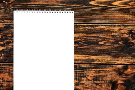 Blank paper on the wooden background, top view, space for text or message. Blank paper mock-up.の写真素材