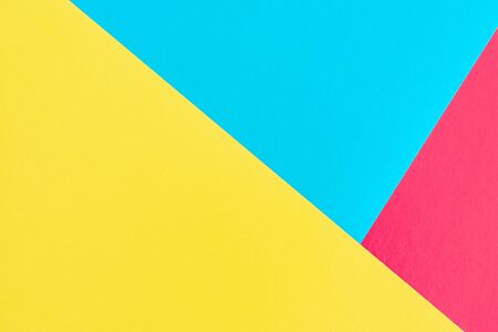 pink, yellow and blue paper background. tri-color background. modern texture. colorful soft colors, geometric triangle shape.の写真素材