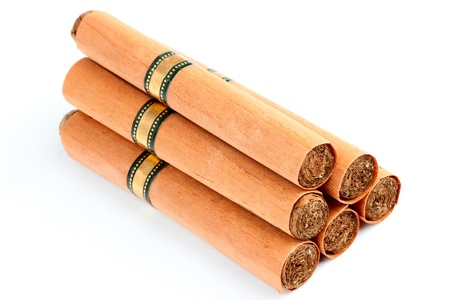 Six Cigars in covers on the white background