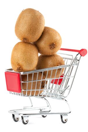 Buying healthy food. Shopping trolley with kiwi on whiteの写真素材