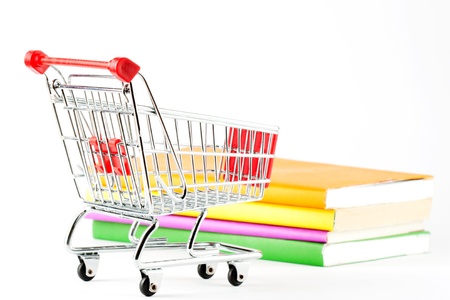Shopping for Books. Shopping Cart with books on the white backgroundの写真素材
