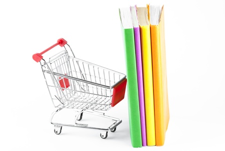 Shopping for Books. Shopping Cart with books on the white backgroundの写真素材