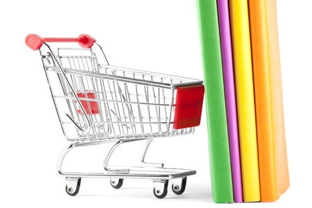 Shopping for Books. Shopping Cart with books on the white backgroundの写真素材