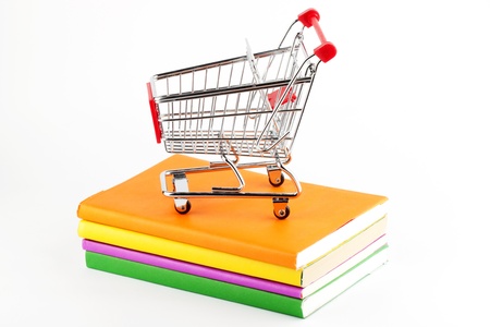 Shopping for Books. Shopping Cart with books on the white backgroundの写真素材