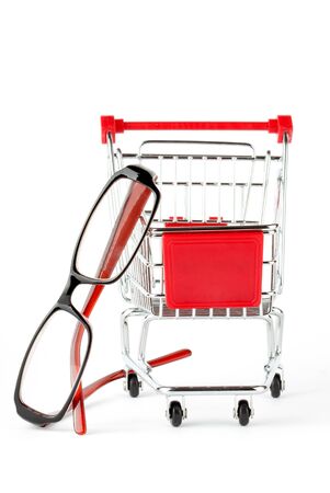 Shopping Cart with eye glasses on the white backgroundの写真素材
