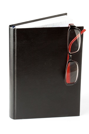 Study. Book with eyeglass on the white backgroundの写真素材