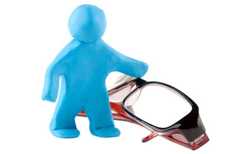 Plasticine man with eyeglass on the white backgroundの写真素材