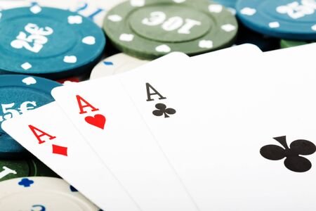 Playing cards and gambling chips extreme closeup