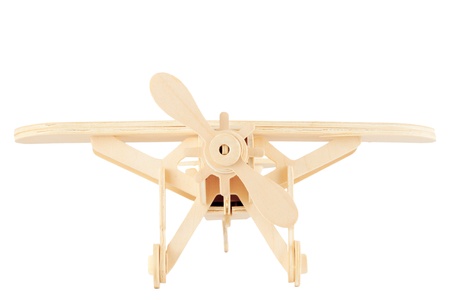 Wooden model of the airplane on a white background の写真素材