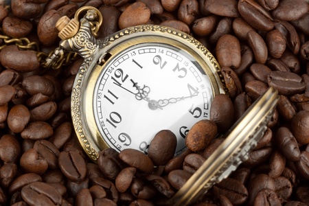 Extreme closeup Pocket watch in coffee beansの写真素材