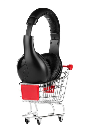 Online shopping for music comcept  Shopping cart with headphones on the white backgroundの写真素材