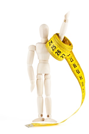 Weight loss Success Concept  Dummy with measuring tape on the white backgroundの写真素材