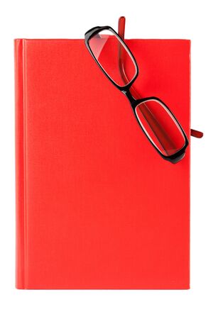 Red book and glasses  on a white background with blank space for your textの写真素材