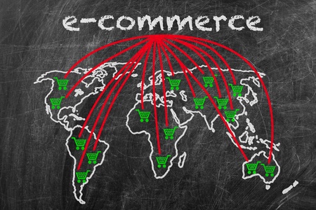 E-commerce business written on a blackboard with world map signの写真素材