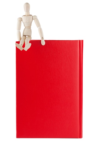 Dummy sitting over the books on a white backgroundの写真素材