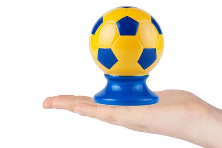 Hand hold Soccer ball with Ukrainian flag on a white backgroundの写真素材