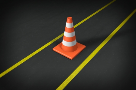 Orange closeup Safety Traffic Cones on an asphalt roadの写真素材