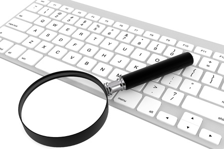 Magnifying glass with keyboard on a white backgroundの写真素材