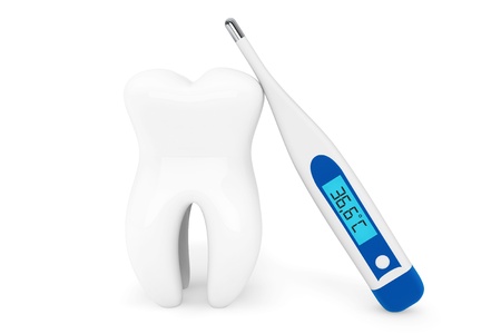 Stomatology concept. Extreme closeup tooth with thermometer on a white background