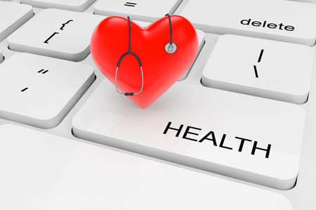 Health Care concept. Extreme closeup red heart with stethoscope on a keyboardの写真素材