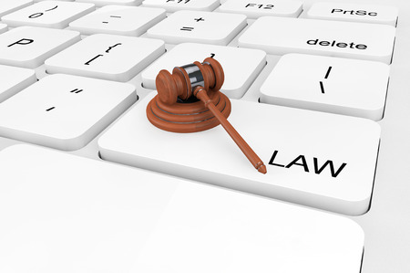 Law concept. Extreme closeup Judge Gavel on a keyboardの写真素材