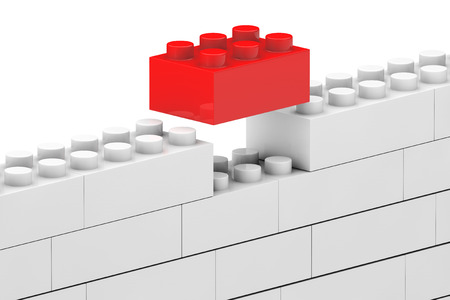 Wall from children plastic blocks on a white backgroundの写真素材