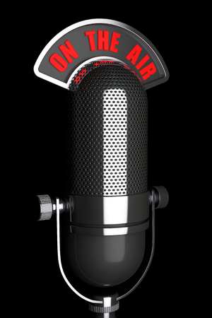 Vintage silver microphone with On The Air Sign on a black backgroundの写真素材