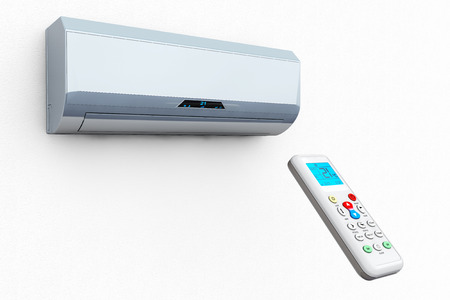 Modern air conditioner with remote on a white backgroundの写真素材