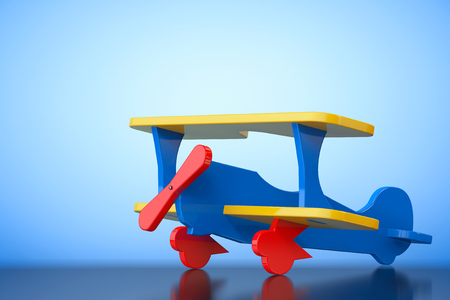 Toy Multicoloured Biplane on a blue background. 3d Renderingの写真素材