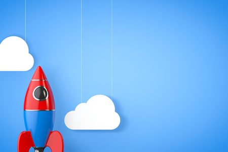 Toy Rocket with Clouds on a blue background. 3d Renderingの写真素材