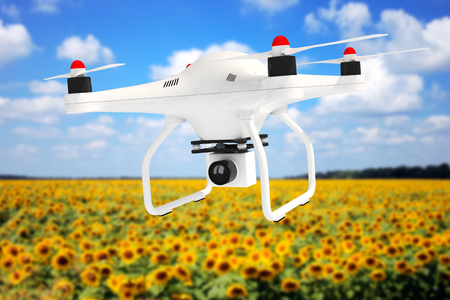 White Quadrocopter drone with Photo Camera n front of landscape background. 3d Renderingの写真素材