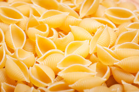 Dry Uncooked Italian Macaroni Pasta Background Texture extreme closeupの写真素材
