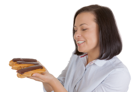Beautiful Pretty Young Woman with Chocolate Eclair on a white background