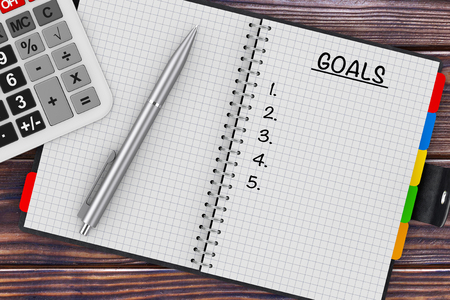 Goals Planning Concept. Calculator, Pen and Organizer with Goals Sign on a wooden table. 3d Rendering の写真素材