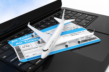 White Jet Passenger's Airplane with Airline Boarding Pass Tickets over Modern Laptop Computer Keyboard extreme closeup. 3d Rendering. の写真素材