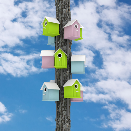 Many of Little Colorful Wooden Birdhouses over Tree Post on a blue sky background. 3d Rendering.の写真素材