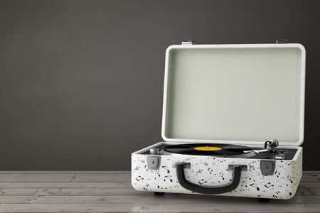 Portable Vintage Style Music Player Turntable in White Case on a wooden table. 3d Renderingの写真素材